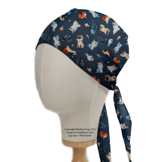 The Medicus Scrub Caps Cats Love Yarn Scrub Cap, crafted from hypoallergenic cotton, features playful cat, yarn ball, fishbone, and paw illustrations. NHS-compliant and perfect for medical use, it ties at the back for comfort.