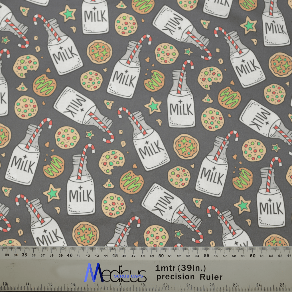 The Christmas Milk + Cookies Grey Scrub Cap by Medicus Scrub Caps features a festive design with milk bottles, cookies, candy canes, and green stars on a gray background. A meter-long ruler is included at the bottom.