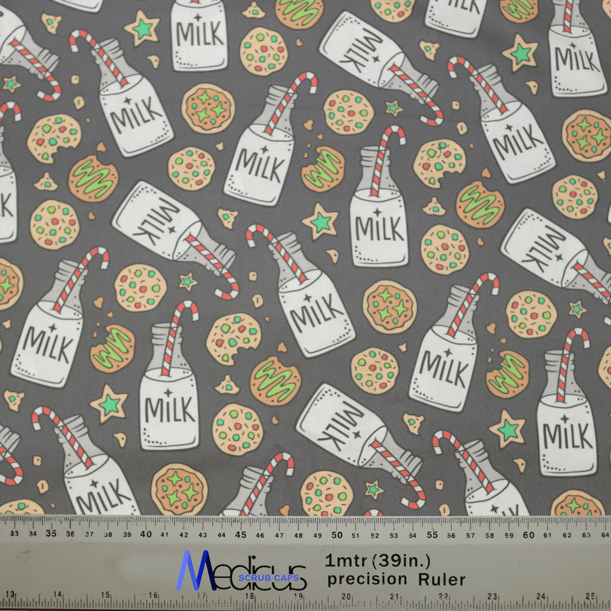 The Christmas Milk + Cookies Grey Scrub Cap by Medicus Scrub Caps features a festive design with milk bottles, cookies, candy canes, and green stars on a gray background. A meter-long ruler is included at the bottom.