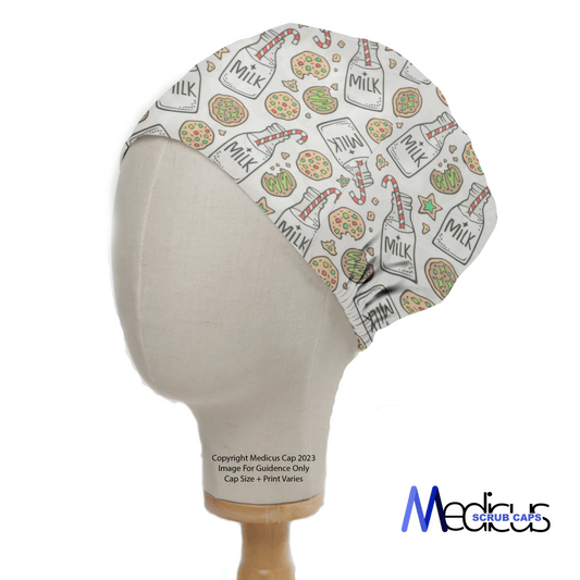 A side view of a mannequin head wearing a Christmas Milk + Cookies White Scrub Cap shows festive prints of milk bottles, cupcakes, and cookies on a white background. Medicus Scrub Caps is boldly displayed in blue and black text, embodying the holiday spirit.