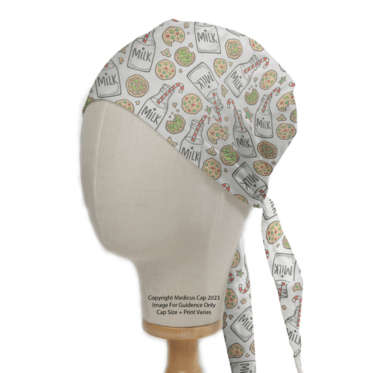 A Medicus Scrub Caps mannequin head displays the Christmas Milk + Cookies White Scrub Cap, featuring a lively print of milk cartons, pizza slices, and bottles on a light background that enhances the festive spirit.