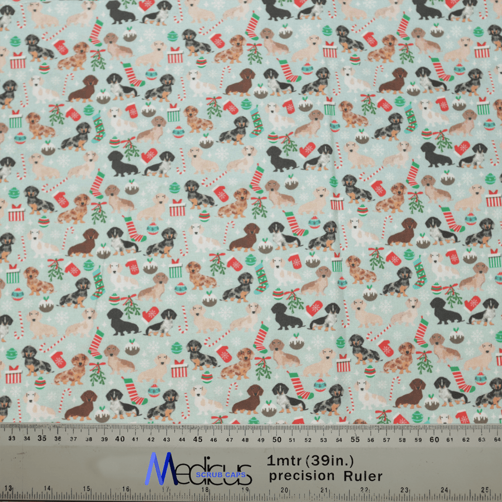 The Christmas Party Dogs Animals Scrub Cap by Medicus Scrub Caps features festive pups with stockings, presents, and decorations on a light background. A ruler at the bottom displays both inches and centimeters for precise cutting, perfect for holiday crafting needs.