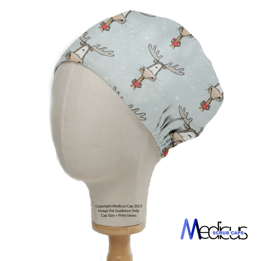 Side view of a mannequin in a Christmas Reindeer Big Scrub Cap by Medicus Scrub Caps, set against a light blue backdrop. The festive fabric features snowflakes with Copyright Medicus Cap 2023 and the Medicus logo on display.