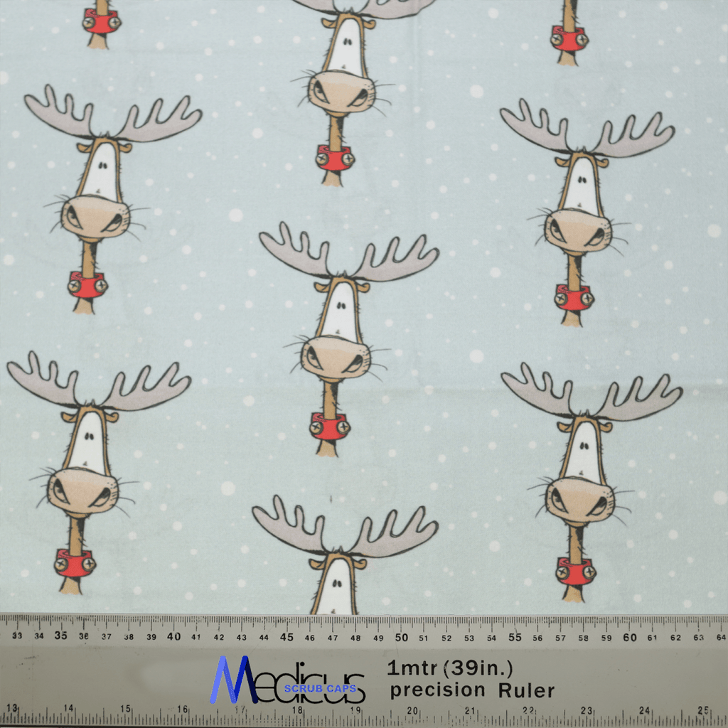 The Christmas Reindeer Big Scrub Cap by Medicus Scrub Caps features festive reindeer in red scarves on a light blue background with white dots, ideal for crafting a cozy scrub cap. A precision ruler at the bottom shows 1mtr (39in.) MCFAB UK for scale.