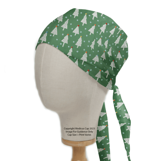 The Medicus Scrub Caps product, Christmas Trees Scrub Cap, shown on a mannequin, displays a green color with festive tree patterns featuring red ornaments and snowflakes. It ensures a perfect fit with its two long ties at the back for secure fastening.