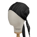 A Classic Plain Black Scrub Cap by Medicus Scrub Caps is showcased on a mannequin head, featuring a smooth texture and back ties with two long straps. Perched on a wooden base, this essential accessory for medical professionals has visible text enhancing its practical appeal.