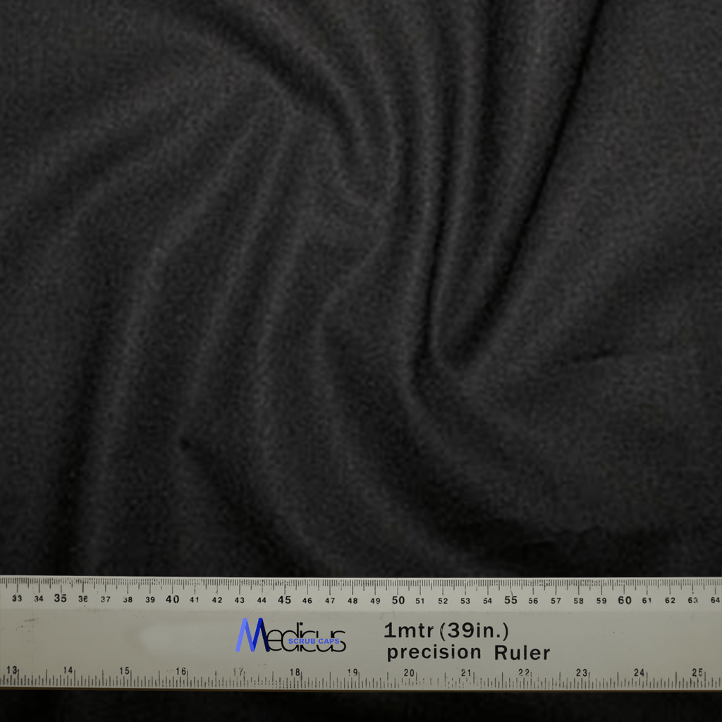 A Classic Plain Black Scrub Cap by Medicus Scrub Caps features a subtle swirling pattern under a durable silver 1-meter (39-inch) ruler with clear black markings. The Medicus brand, trusted by medical professionals, is prominently displayed.