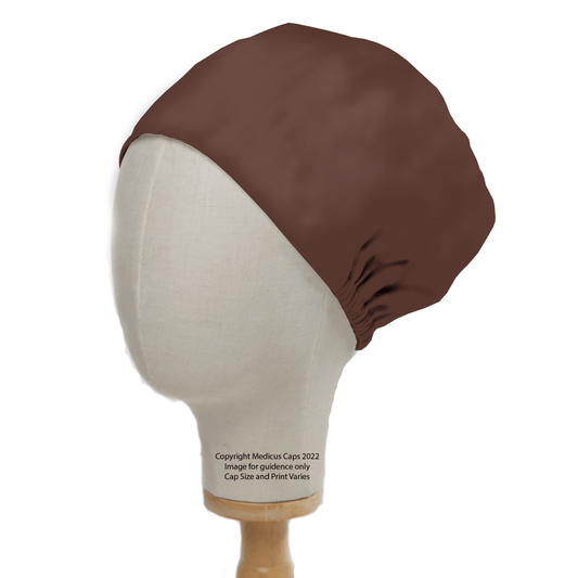 A mannequin head showcases the Medicus Scrub Caps Classic Plain Brunette Brown Scrub Cap, fitting snugly to cover the ears and gather at the back, perfect for medical professionals. Its mounted on a wooden stand.