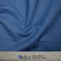 The Classic Plain Copen Blue Scrub Cap by Medicus Scrub Caps is showcased draped over a precision ruler marked 1mtr (39in.), highlighting its textured surface and gentle folds, ensuring tailored comfort in every hypoallergenic textile.