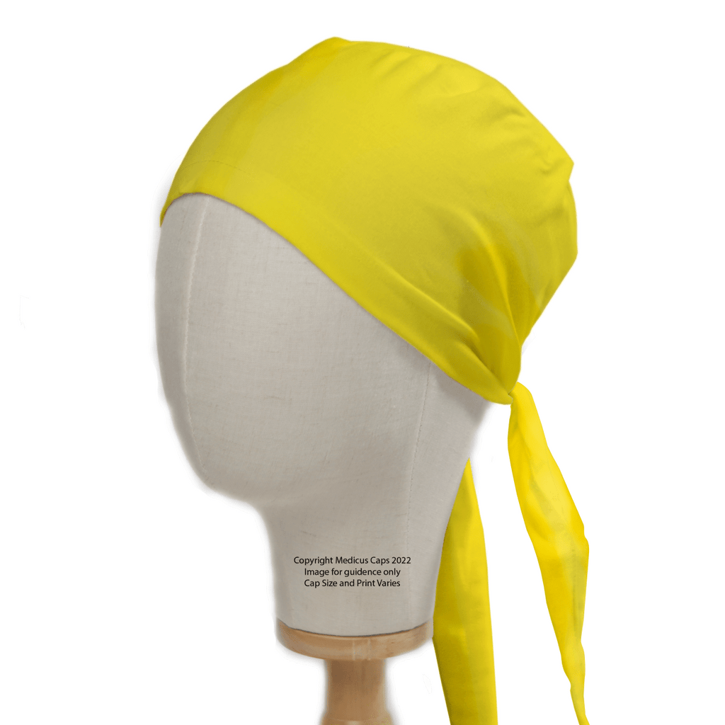 A mannequin head displays a Classic Plain Corn Yellow Scrub Cap by Medicus Scrub Caps, showcasing its bright color and smooth fabric. The long ties wrap neatly for a perfect fit, with the ends elegantly draping down one side.