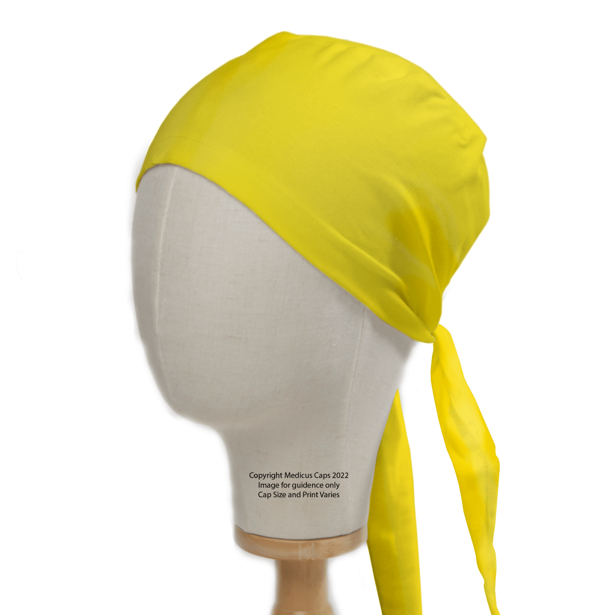 A mannequin head displays a Classic Plain Corn Yellow Scrub Cap by Medicus Scrub Caps, showcasing its bright color and smooth fabric. The long ties wrap neatly for a perfect fit, with the ends elegantly draping down one side.