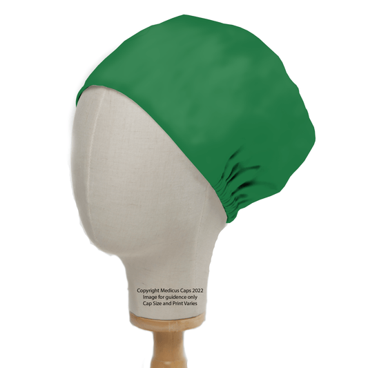 The Medicus Scrub Caps Classic Plain Fir Green Scrub Cap, aka Theatre Hat, is displayed on a mannequin head against a white backdrop. It fully covers the head with gathered fabric at the back, offering healthcare professionals both functionality and timeless style.