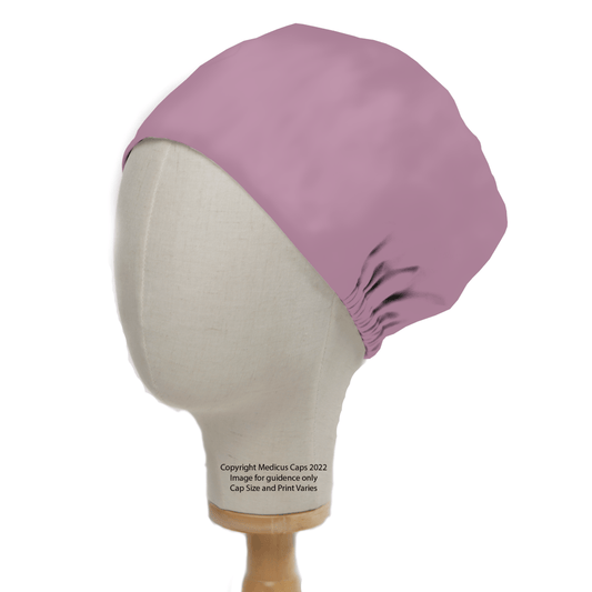 A Classic Plain Lavender Purple Scrub Cap by Medicus Scrub Caps, elegantly minimal on a wooden stand against a white background, is displayed on a mannequin head. Its elastic back ensures a perfect fit, enveloping the entire head—ideal for healthcare professionals.