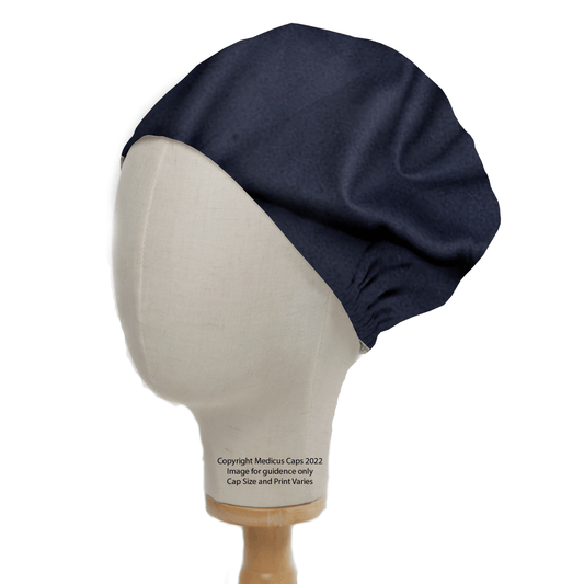 The Classic Plain Navy Scrub Cap by Medicus Scrub Caps, a textured, gathered loose-fit theatre hat in navy, is displayed on a beige mannequin with a wooden base. Its ideal for healthcare professionals and includes text detailing usage rights and image guidance from Meckus Caps 2022.