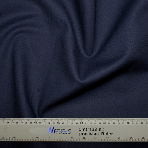 A Classic Plain Navy Scrub Cap from Medicus Scrub Caps, with visible folds, is shown with a gray precision ruler measuring up to 1 meter (39 inches) labeled Medicus, highlighting the attention to detail appreciated by healthcare professionals for achieving a custom fit.