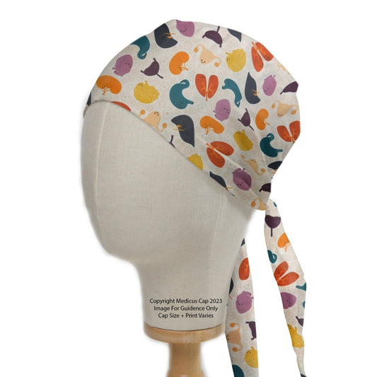 A mannequin head displays the Colourful Organs Hearts Kidneys scrub cap by Medicus Scrub Caps, featuring a vibrant abstract pattern in orange, teal, purple, pink, and yellow. Ideal for healthcare professionals, it includes side ties for secure fastening and adds a splash of color to the workplace.