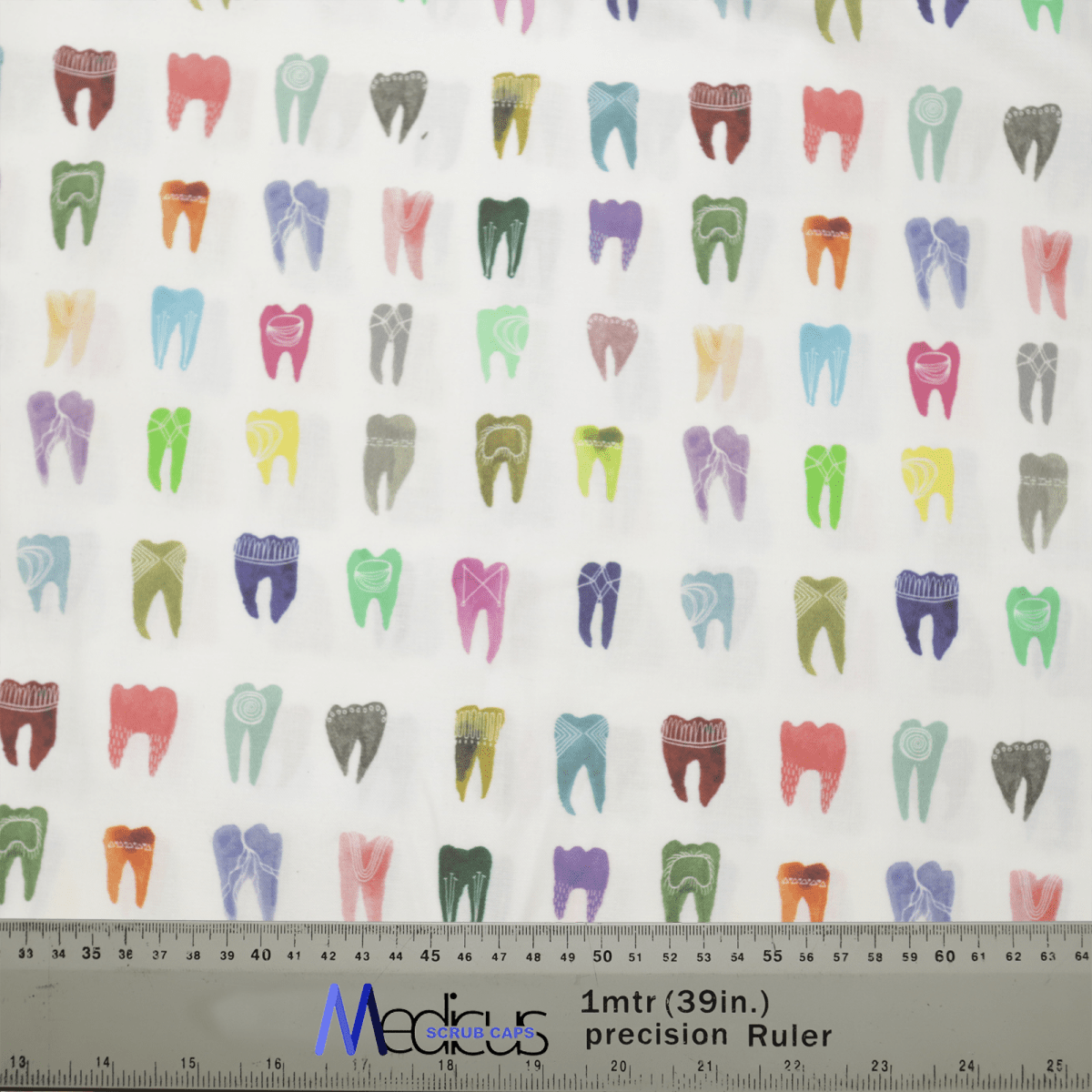 Featuring a vibrant pattern of illustrated teeth in various shades on white fabric, the Medicus Scrub Caps Colourful Tooth Dentist Scrub Cap is ideal for dental professionals. A ruler with inches and centimeters indicates scale at the bottom.