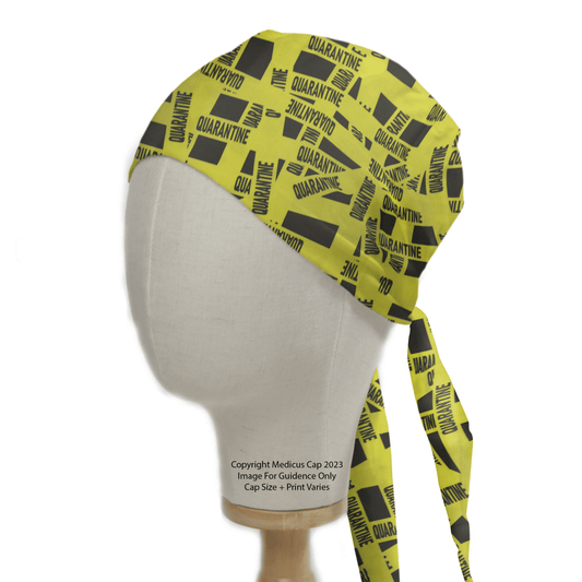 A mannequin head models the Covid Quarantine Tape Scrub Cap by Medicus Scrub Caps, featuring bold quarantine-themed graphics in yellow and black with adjustable ties.