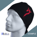 A mannequin head sports a Medicus Scrub Caps black cap with a red martial arts kick graphic on high-quality fabric. The diagonally split green and gray background, along with Medicus and EXAMPLE in the corners, adds flair to this Custom Scrub Cap With Personalized Embroidery design.