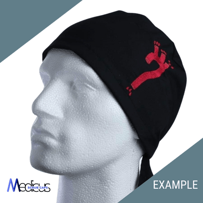 A mannequin head sports a Medicus Scrub Caps black cap with a red martial arts kick graphic on high-quality fabric. The diagonally split green and gray background, along with Medicus and EXAMPLE in the corners, adds flair to this Custom Scrub Cap With Personalized Embroidery design.