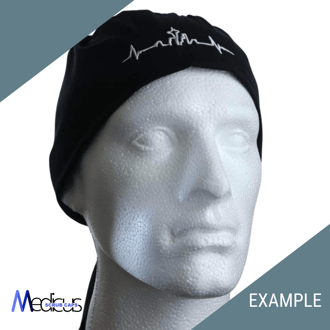 A mannequin head wears a black headwrap from Medicus Scrub Caps, showcasing a white embroidered design of a heartbeat and skyline made from premium fabric. Medicus and EXAMPLE are highlighted on green and gray sections. Perfect for custom scrub caps with personalized embroidery.