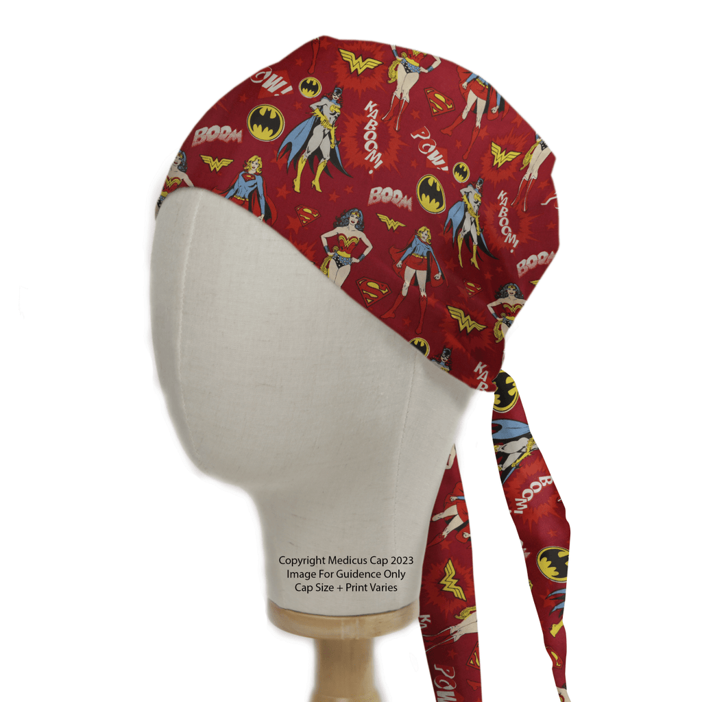 The Medicus Scrub Caps DC Comic Super Women Heros On Red Scrub Cap showcases iconic character motifs, comic-style text like POW! and BOOM!, and symbols like lightning bolts and bat emblems, adding superhero flair to any healthcare attire.