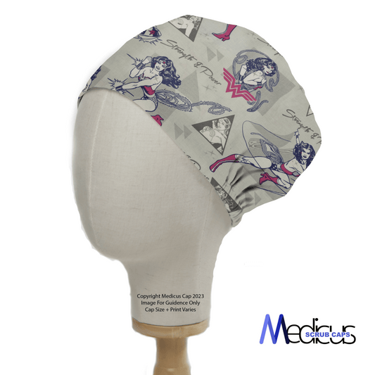 The DC Comic Wonder Woman Strength and Power Scrub Cap by Medicus Scrub Caps features comic-style illustrations of Wonder Woman in various poses. This primarily grey cap with red and blue accents stands out beautifully against a plain white background, making it perfect for healthcare professionals.