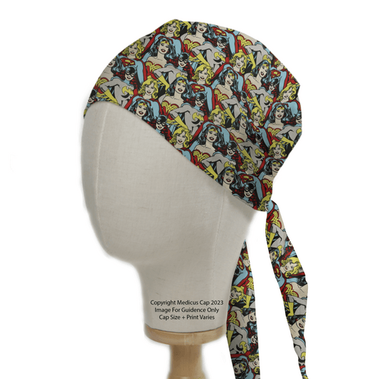 A mannequin head displays the Medicus Scrub Caps DC Super Women Girl Bat Girl Crowd Scrub Cap, featuring a vibrant comic book hero pattern for healthcare professionals.