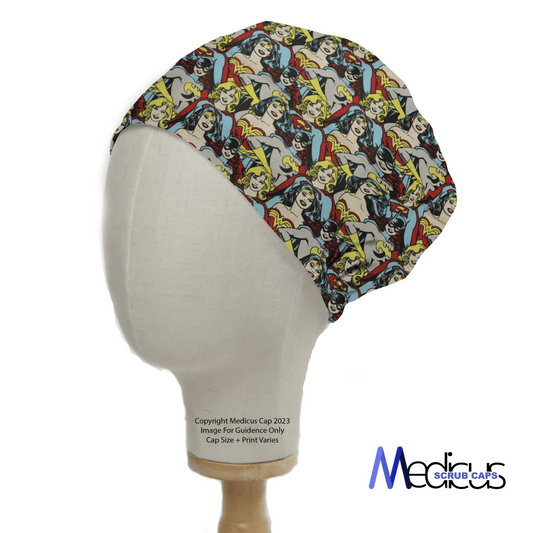 A mannequin head showcases the DC Super Women Girl Bat Girl Crowd scrub cap from Medicus Scrub Caps, featuring a vibrant comic-themed design for healthcare professionals.