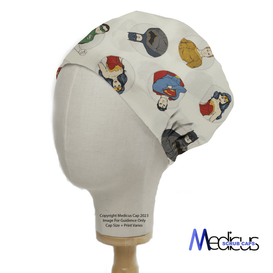 A mannequin head models a DC Universe Character Circles White Scrub Cap by Medicus Scrub Caps, featuring colorful superhero designs on a light fabric.