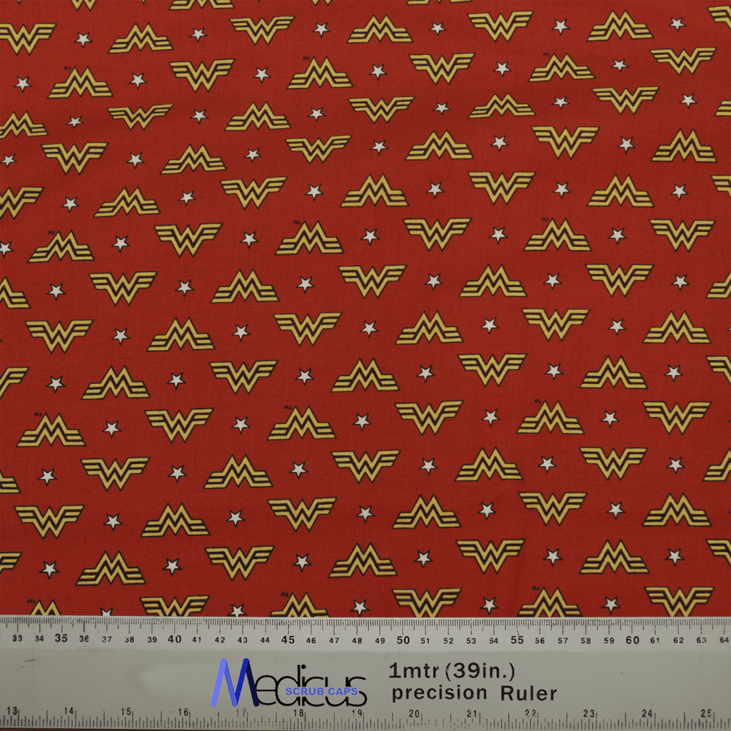 The DC Wonder Woman Symbol WW On Red Scrub Cap by Medicus Scrub Caps features yellow logos, white stars, and a precision ruler for scale.