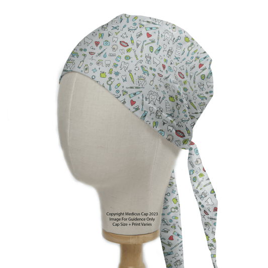 A Medicus Scrub Caps mannequin displays the Dental Teeth Dentist Mash Up Scrub Cap, featuring a vibrant medical-themed print with stethoscopes and syringes on white. Ideal for healthcare settings, it ties at the back, adding flair to medical or dental environments.