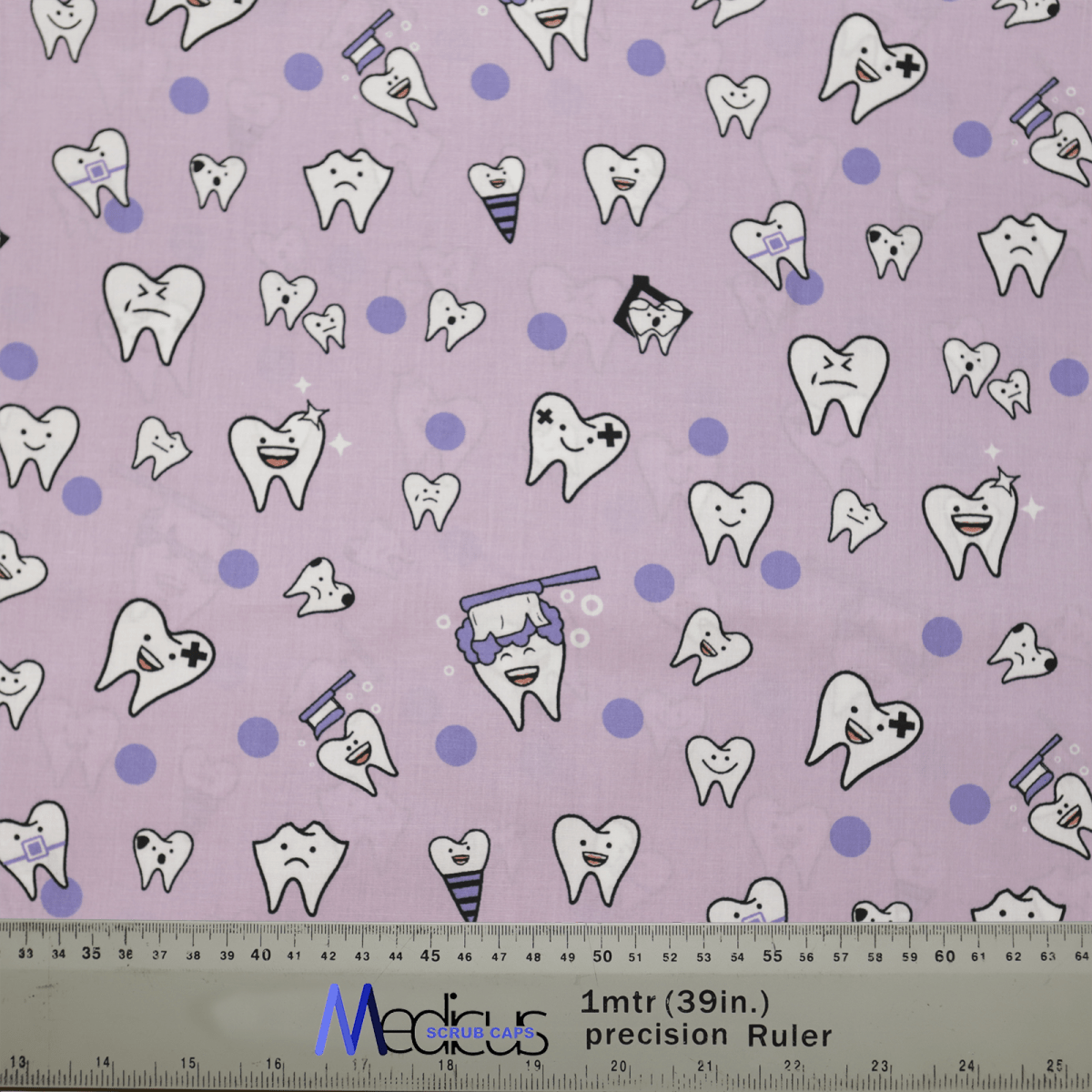 The Dentist Happy Teeth Purple Scrub Cap by Medicus Scrub Caps features patterned fabric with cartoon teeth displaying various expressions, like smiling and angry, on a radiant smiles backdrop with small polka dots. A ruler at the bottom shows measurements in inches and centimeters.