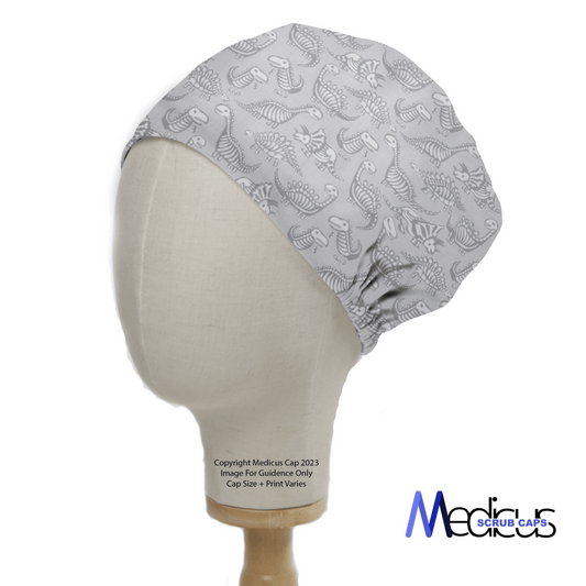 The Dinosaur Dig #2 Scrub Cap from Medicus Scrub Caps features a white dinosaur bone pattern on a mannequin head, exuding prehistoric charm. Its fitted design showcases the Medicus Scrub Caps logo at the bottom right, with copyright and image guidance text on the left.