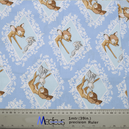 The Disney Bambi Thumper Blue Diamond Scrub Cap by Medicus features a pattern of Bambi and Thumper in diamond shapes on blue, with a 1-meter ruler for scale—ideal for healthcare professionals seeking charming attire.