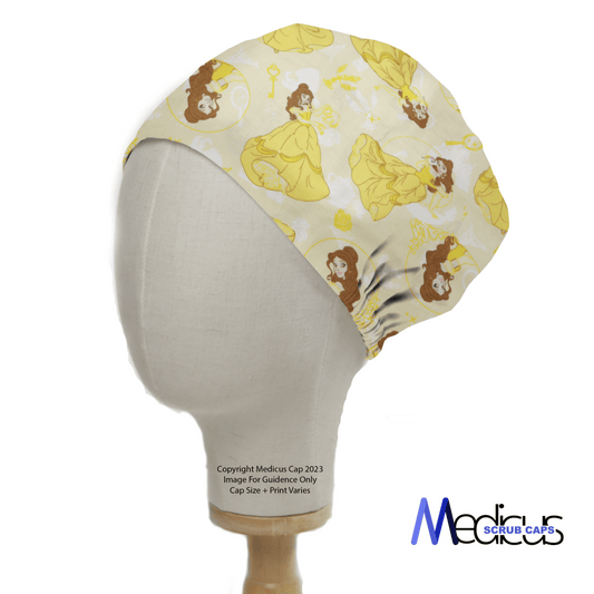 A mannequin displays the Disney Princesses | Belle Scrub Cap by Medicus Scrub Caps, featuring a yellow print with a flowing dress illustration similar to Disney Princesses against a light patterned background, with the logo subtly in the corner for comfort and style.