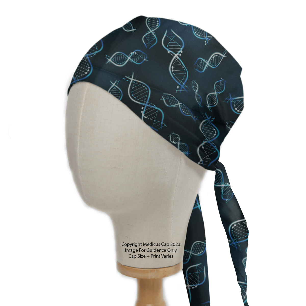 A mannequin head models the DNA Science Scrub Cap by Medicus Scrub Caps, featuring blue and white DNA helix designs on a dark background. It embodies the spirit of genetic exploration with a stylish tied section at the back.