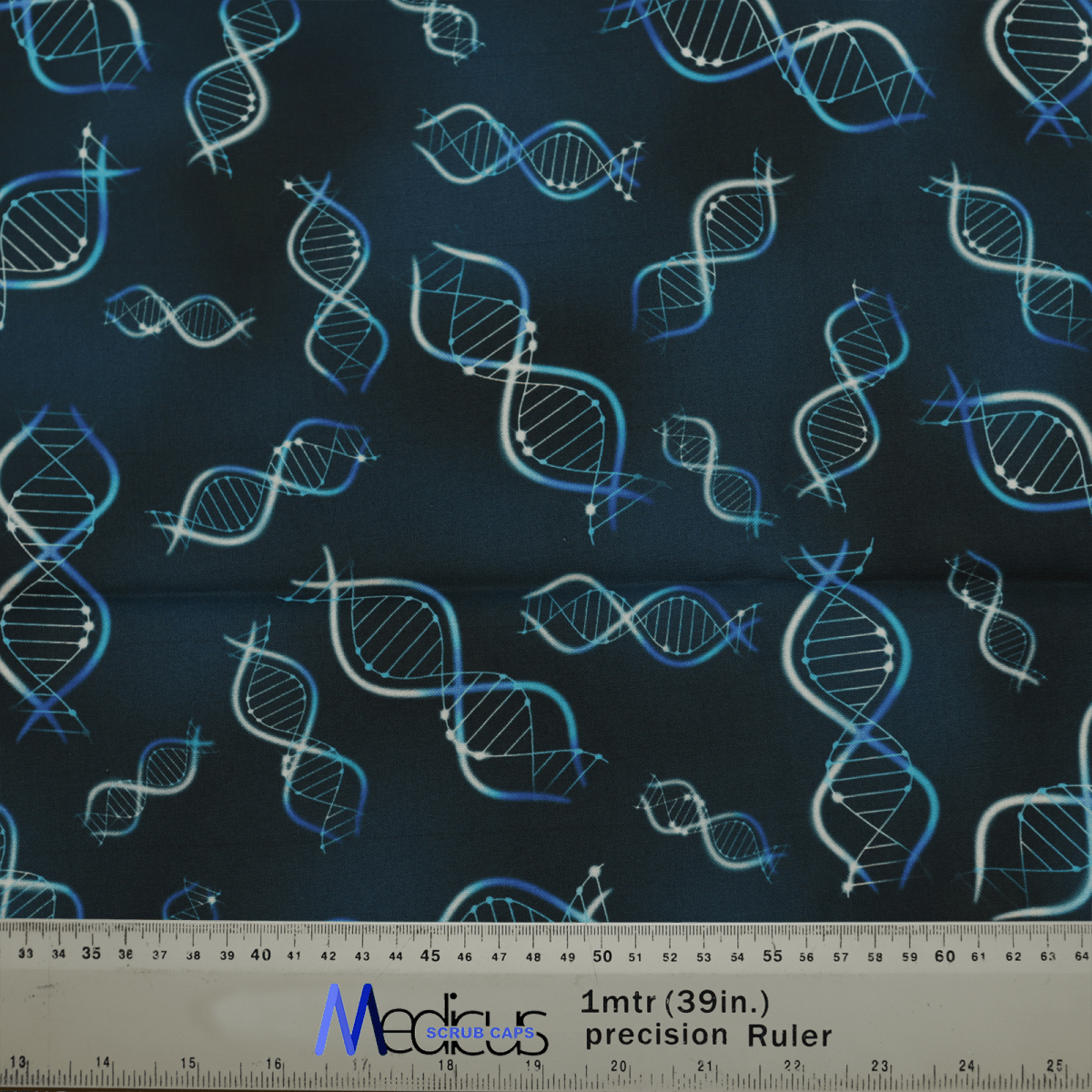 Fabric with a dark background adorned with blue and white DNA helixes, ideal for genetic exploration enthusiasts. A ruler marked Medicus Scrub Caps and 1mtr (39in.) precision Ruler measures in inches.