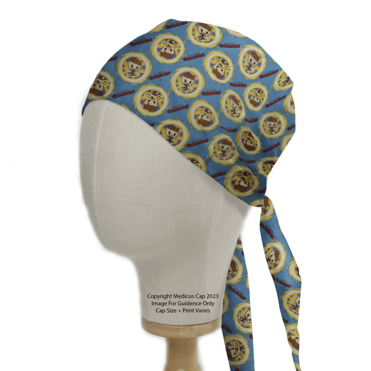 A mannequin head sports the eco-friendly Doctor Strange Kawaii Superhero Scrub Cap by Medicus Scrub Caps, showcasing circular logos with a cartoon raccoon face and Surgical in bold red.