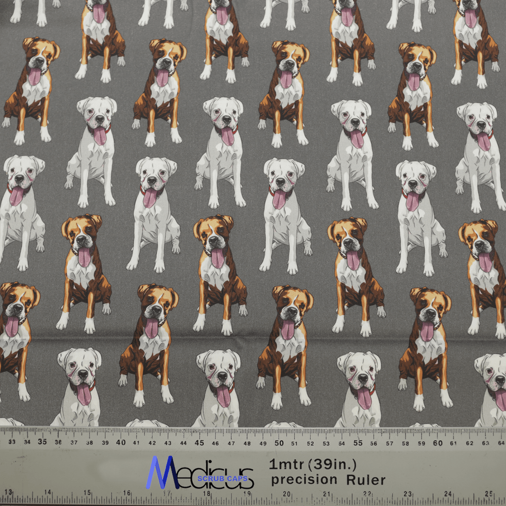 Medicus Scrub Caps Dog Breeds Boxers Grey Scrub Cap features fabric with images of brown, white, and pure white boxers. It includes a 1mtr(39in) precision ruler for cutting, making it perfect for crafting adjustable scrub caps and ideal for boxer dog breed enthusiasts.