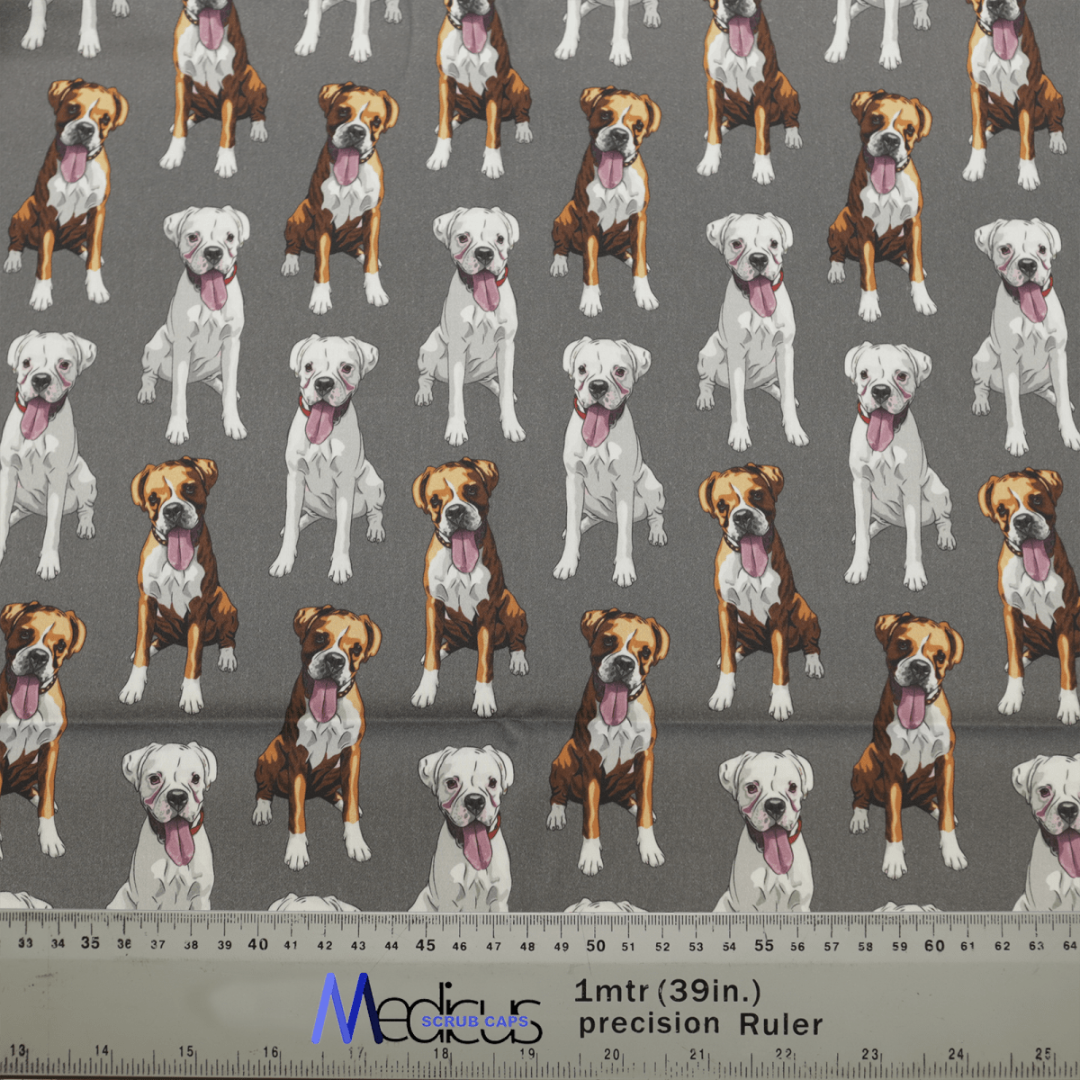 Medicus Scrub Caps Dog Breeds Boxers Grey Scrub Cap features fabric with images of brown, white, and pure white boxers. It includes a 1mtr(39in) precision ruler for cutting, making it perfect for crafting adjustable scrub caps and ideal for boxer dog breed enthusiasts.