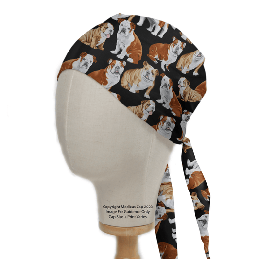 Modeled on a mannequin head, the Medicus Scrub Caps Dogs British Bulldog Scrub Cap showcases a playful pattern of brown and white Bulldogs on black. With a tie-back for style, its also sustainable due to its copyrighted fabric.