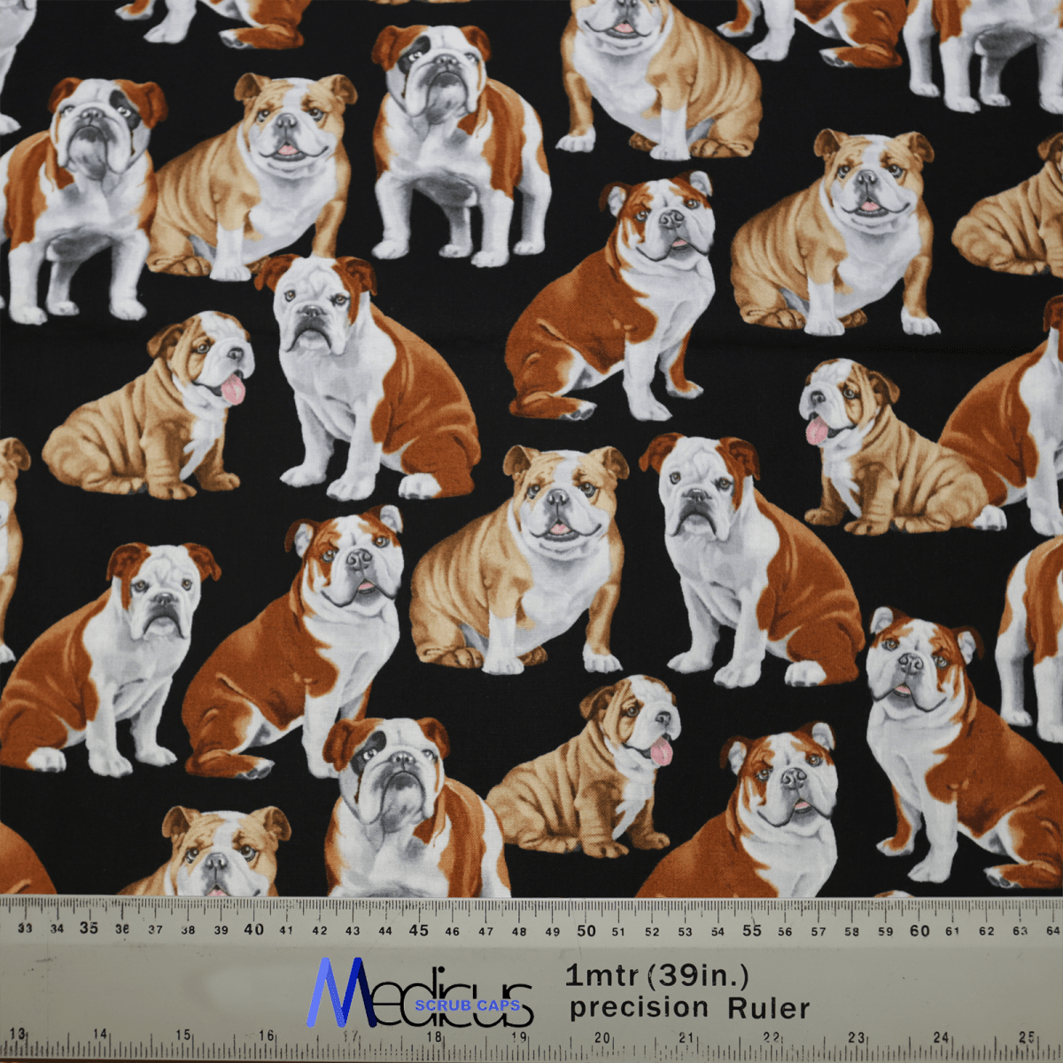 The Medicus Scrub Caps Dogs British Bulldog fabric features British Bulldogs on a black background, ideal for creating a unique and sustainable scrub cap. The design includes a ruler with inch and centimeter markings for accurate scaling—perfect for the eco-conscious creator.