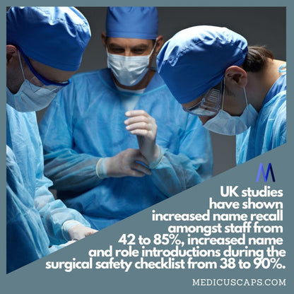 Three medical professionals in blue scrubs, masks, and Medicus Scrub Caps Liver Cute embroidered caps are focused on a task. A dimly lit background features text discussing UK studies on improved name recall, role introductions, and checklist enhancements linked to these caps.