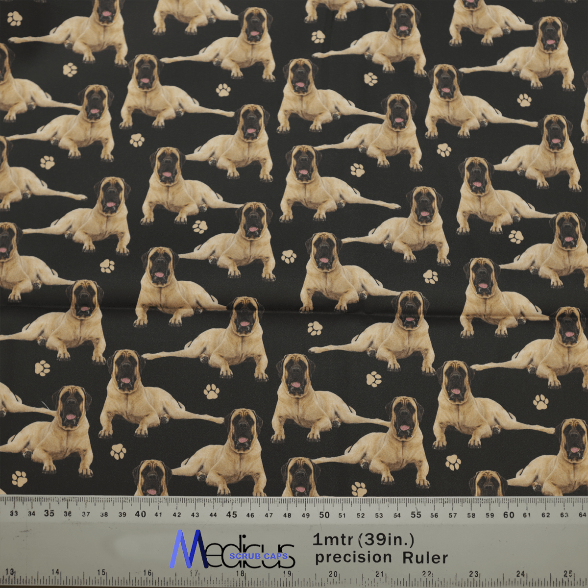 The Medicus Scrub Caps English Bull Mastiff Dogs Black Scrub Cap features a light brown English Bull Mastiff on a dark background with small paw prints. Its perfect for scrub caps and includes a measurement ruler in inches and centimeters.