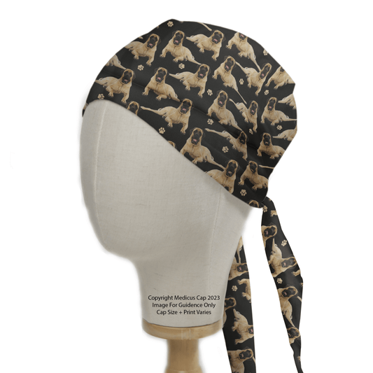 The English Bull Mastiff Dogs Black Scrub Cap from Medicus Scrub Caps features tan dogs and paw prints on black, with long ties at the back. Note: Copyright Medicus Cap 2023 Image For Guidance Only Cap Size + Print Varies. Ideal for adding a playful touch to your healthcare routine.