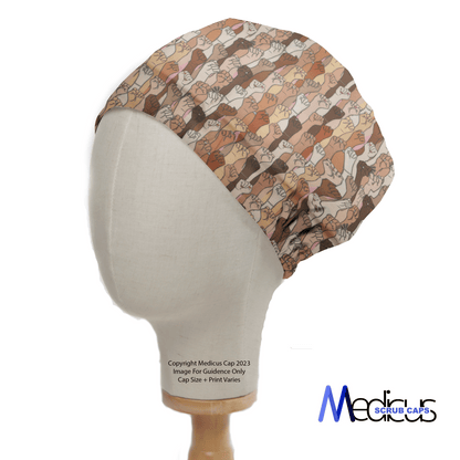 A mannequin head wears a Medicus Scrub Cap, featuring the Equal Rights Girl Power design with variously shaded raised fists symbolizing equal rights.