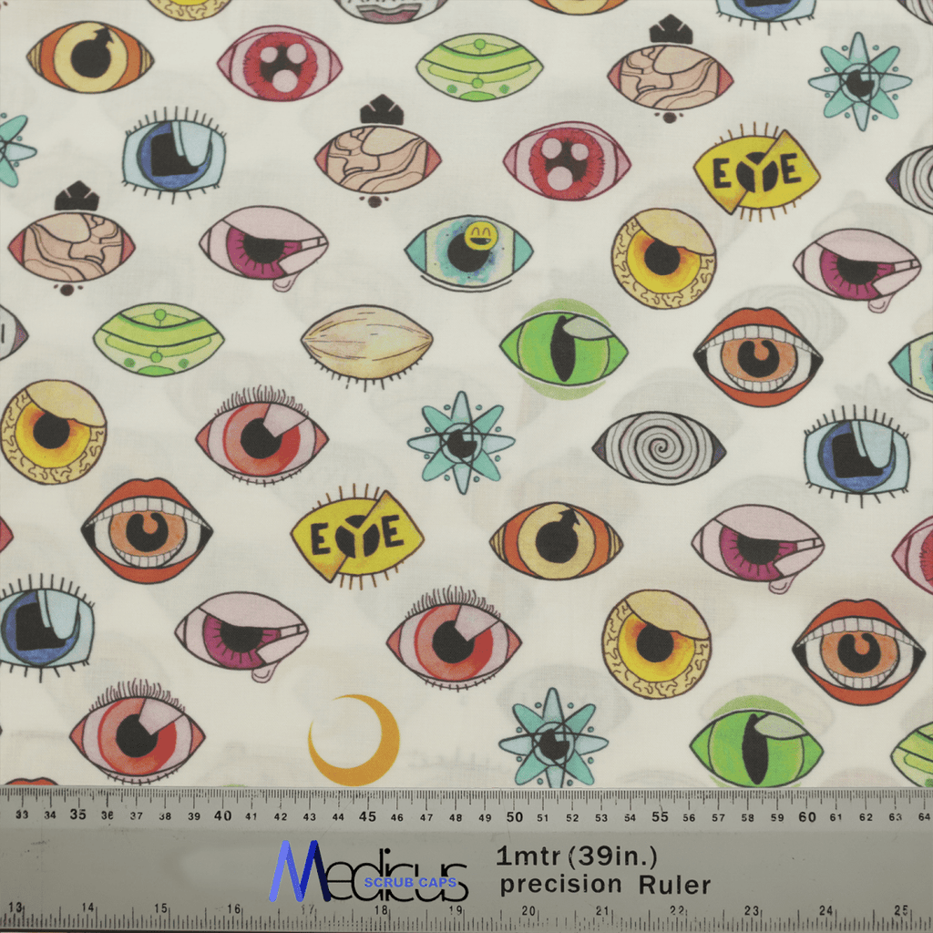 The Eyes Abstract Scrub Cap by Medicus Scrub Caps showcases hand-drawn, colorful eyes with varying styles, some with eyelashes and others in abstract forms. A ruler at the bottom offers scale reference. Perfect for a scrub cap!.