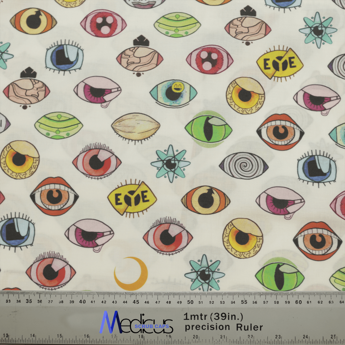 The Eyes Abstract Scrub Cap by Medicus Scrub Caps showcases hand-drawn, colorful eyes with varying styles, some with eyelashes and others in abstract forms. A ruler at the bottom offers scale reference. Perfect for a scrub cap!.