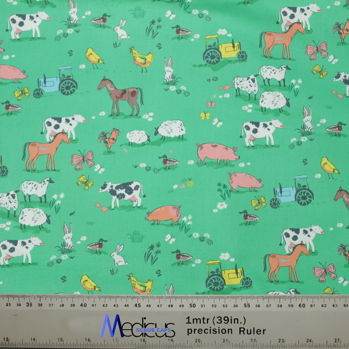 Experience tranquility with the Farmers Field Scrub Cap by Medicus Scrub Caps, made from green fabric featuring farm animals and vehicles like cows, horses, sheep, pigs, rabbits, and more. Measurements in centimeters and inches are included at the bottom for extra comfort.